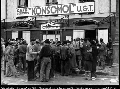 Villagers gather around a collectivized café in Gijon.