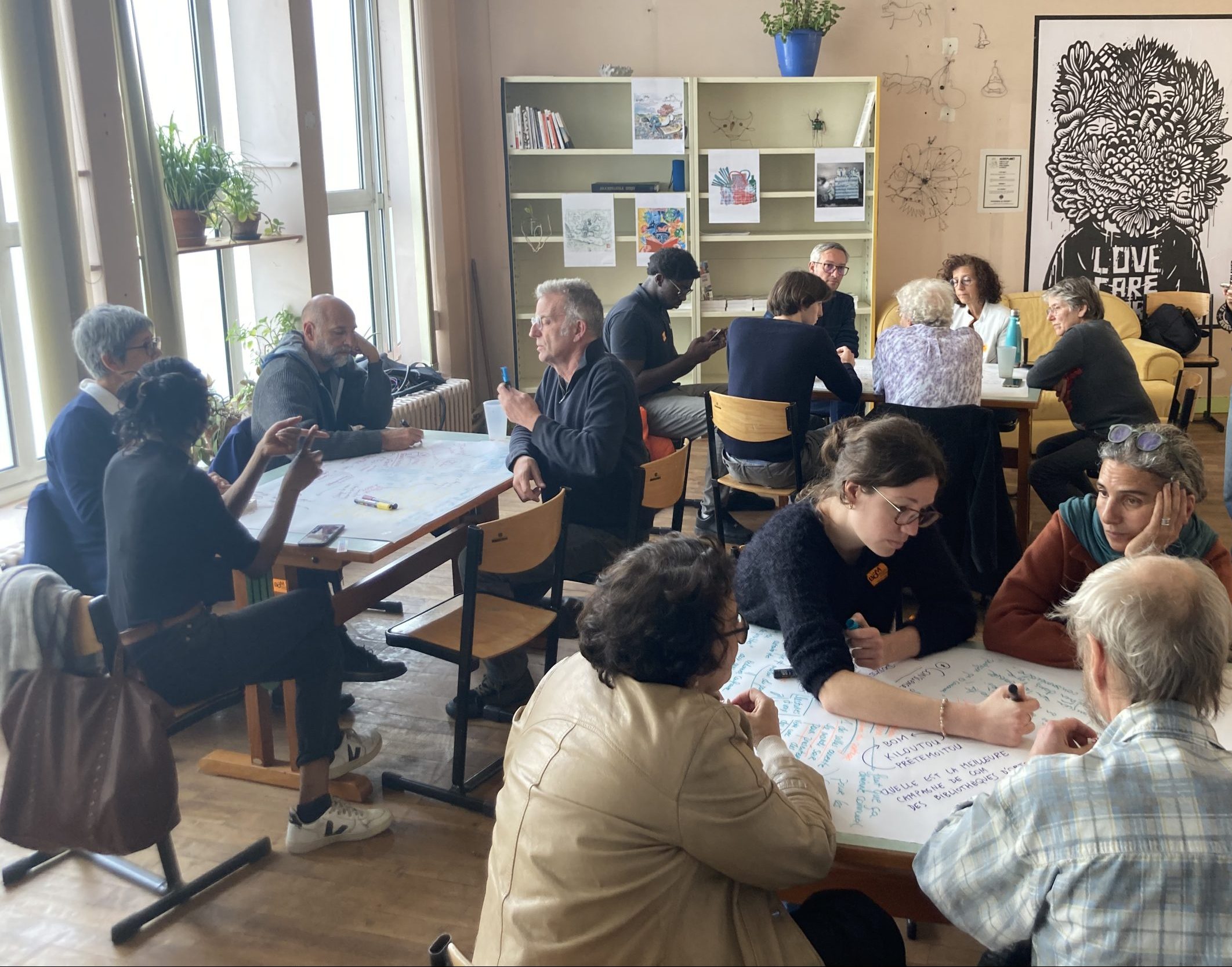 La BOM staff, volunteers, and members participating in a workshop to identify how to better engage and serve the residents of Montreuil. Credit: Shareable