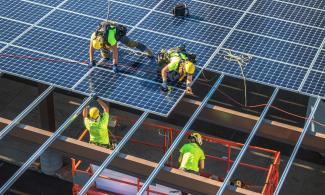 California Solar workers installing large solar array.