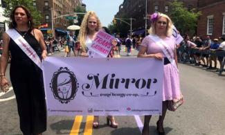 Mirror Trans Beauty Co-op members marching in a 2019 Pride parade.