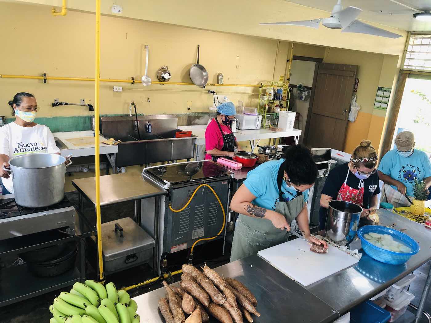 People working together in a mutual aid center.