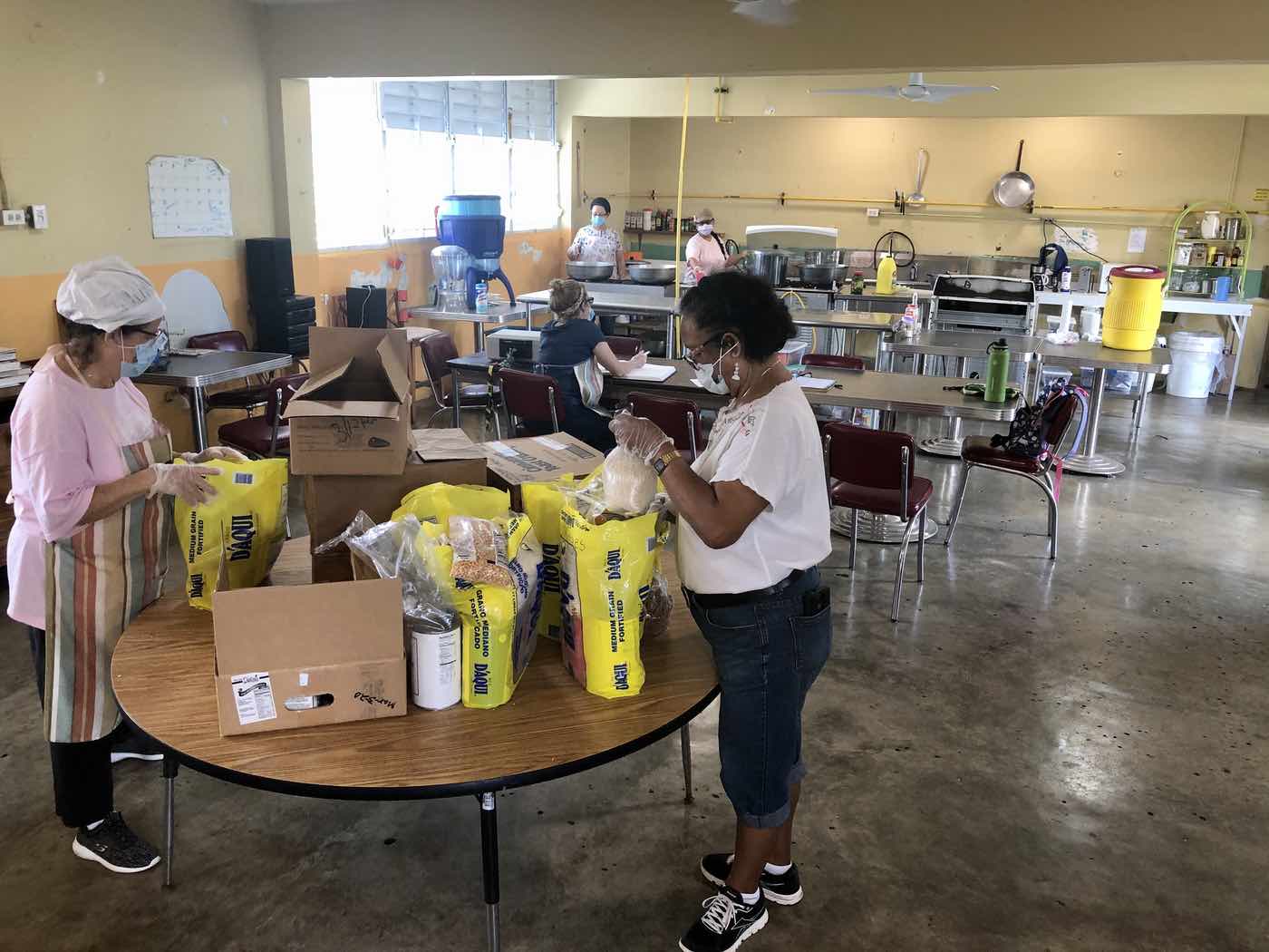 People working together in a mutual aid center.