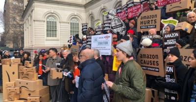 Demonstrators from local worker advocacy groups assembled outside New York's City Hall in December as the City Council held a hearing on Amazon's now-canceled plan to establish a new headquarters in Queens. (Photo: @GoMadeIn/Twitter)