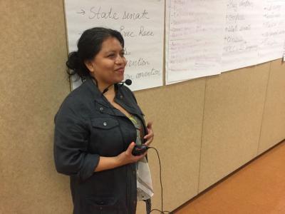 Telesh Lopez of the Caracol Language Coop interprets for the New York Communities for Change staff retreat in July 2017. Photo: Courtesy of Caracol Language Cooperative